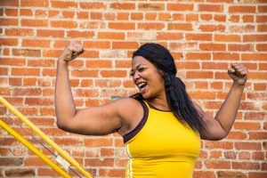 woman showing strong muscles